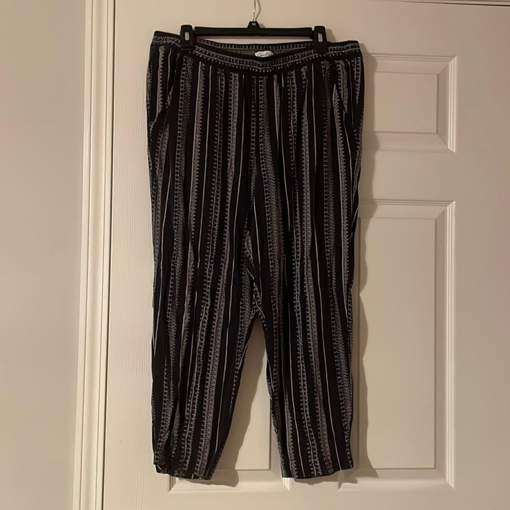 L black lounge pants with Aztec pattern